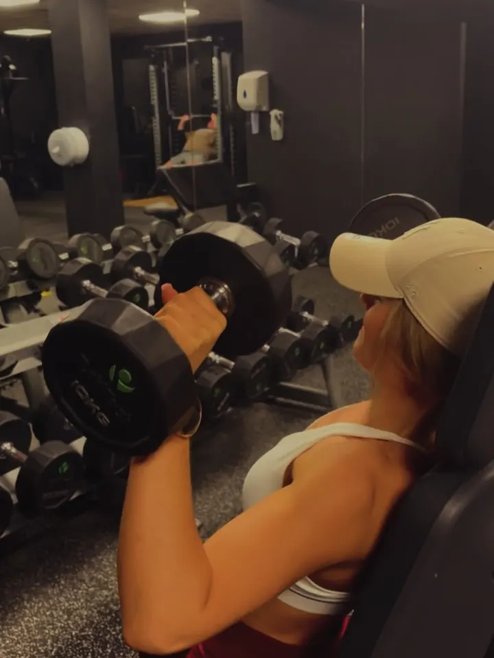 Francesca Milly lifting dumbbells